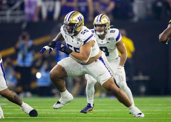 Jan 8, 2024; Houston, TX, USA; Washington Huskies offensive lineman Troy Fautanu (55) against the Michigan Wolverines during the 2024 College Football Playoff national championship game at NRG Stadium.